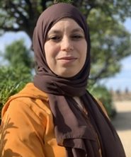 Portrait of Fatima Ballah in black and white in an oval shape.