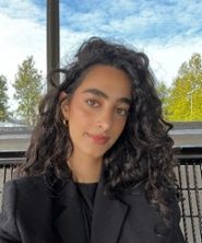 Portrait of Moonya Amro in black and white in an oval shape.