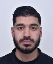 Portrait of Rashed Nazrabi in black and white in an oval shape.