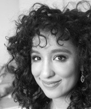 Portrait of Sara Bolghiran in black and white in an oval shape.