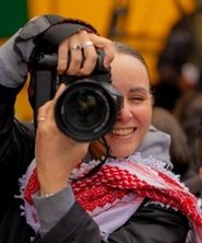 Portrait of Wassila Aarab in black and white in an oval shape.